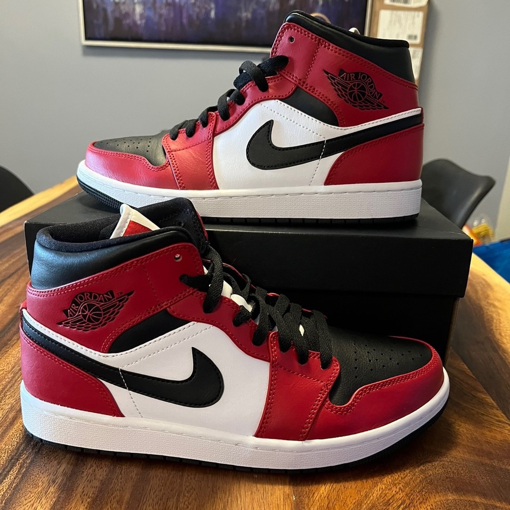 Jordan 1 Mid Chicago Toe black, white & Gym Red leather and nylon upper.